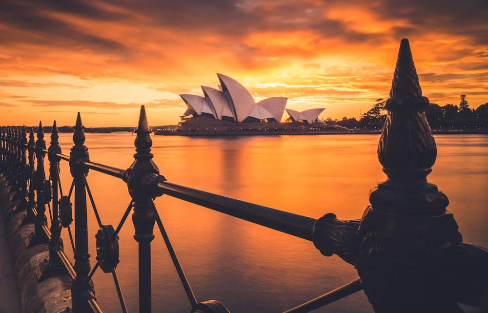 A stunning sunrise, captured behind the famous Sydney Opera House. 
Image taken at Circular Quay, Sydney, Australia.